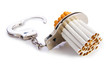 Addition concept with cigarettes and handcuffs