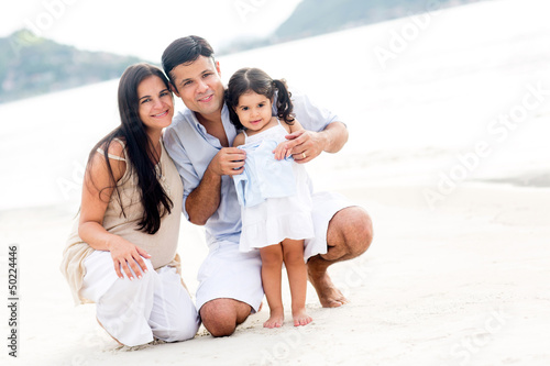 Photo: Family smiling at the beach Family smiling at the beach