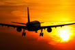 Plane landing in sunrise