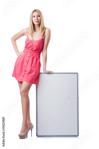 Photo: Woman in pink dress with blank board Woman in pink dress with blank board