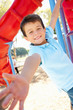 Photo: Boy On Climbing Frame In Park Boy On Climbing Frame In Park