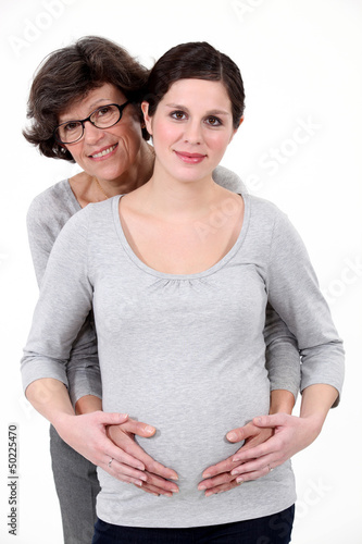 Photo: Pregnant woman stood with mother Pregnant woman stood with mother