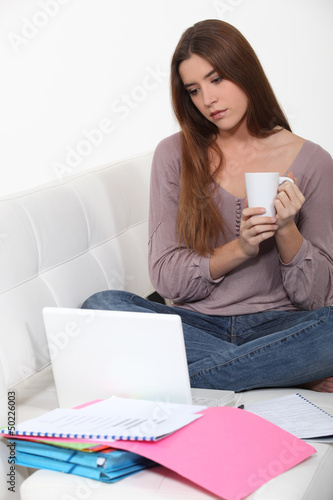 Photo: A brunette studying A brunette studying