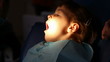 dentist treats teeth child