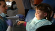 dentist treats teeth child