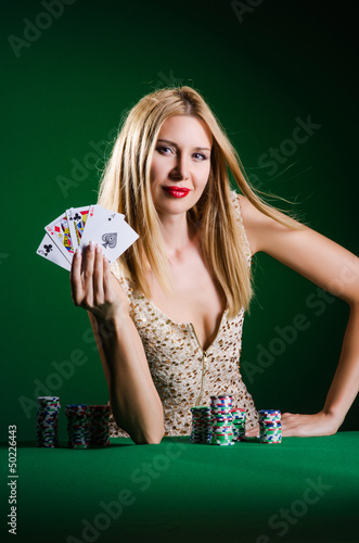 Photo: Woman in casino playing cards Woman in casino playing cards