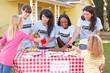 Photo: Women And Children Running Charity Bake Sale Women And Children Running Charity Bake Sale