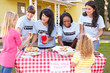 Photo: Women And Children Running Charity Bake Sale Women And Children Running Charity Bake Sale