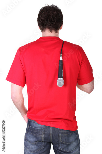 Photo: Man resting microphone over shoulder Man resting microphone over shoulder
