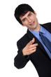 Businessman giving a hand gesture