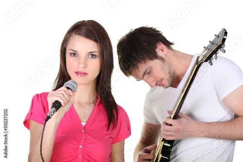 Photo: Female singer and male guitarist Female singer and male guitarist