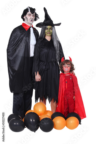Photo: family celebrating Halloween family celebrating Halloween