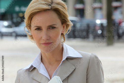 Photo: Businesswoman on the sidewalk Businesswoman on the sidewalk