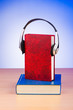 Concept of audio books with earphones on white