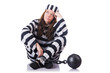 Prisoner in striped uniform on white