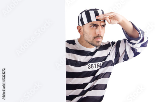 Photo: Convict criminal in striped uniform Convict criminal in striped uniform