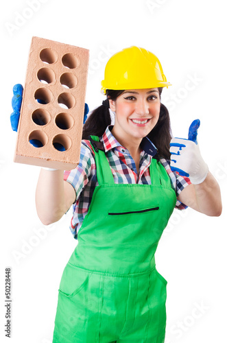 Photo: Woman builder with bricks on white Woman builder with bricks on white