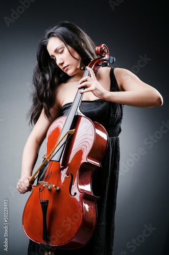Photo: Woman cellist performing with cello Woman cellist performing with cello