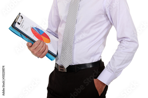 Photo: Businessman holding sales report Businessman holding sales report