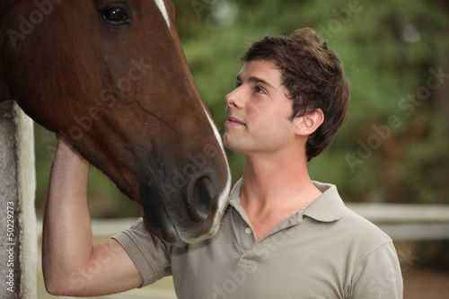 Photo: Man stood with horse Man stood with horse