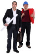 Engineer and tradesman standing side by side