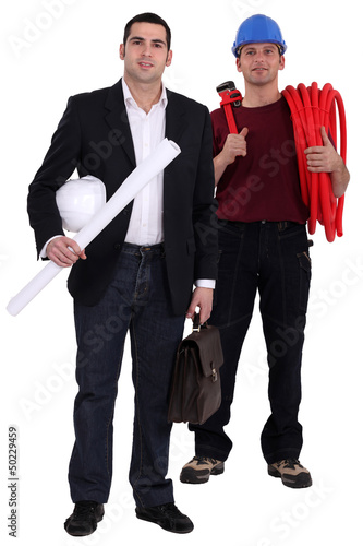 Photo: Engineer and tradesman standing side by side Engineer and tradesman standing side by side