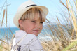Blond boy surrounded by reeds