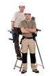 Two electricians stood with ladder