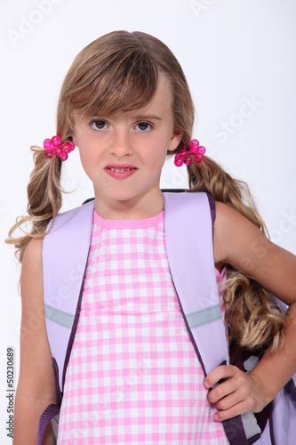 Photo: a little schoolgirl a little schoolgirl