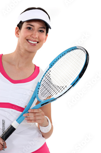 Photo: woman playing tennis woman playing tennis