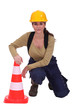 Woman with a traffic cone