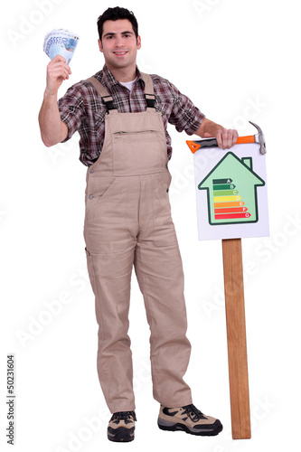 Photo: Worker holding energy efficiency chart Worker holding energy efficiency chart
