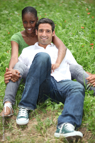 Photo: portrait of a couple on the grass portrait of a couple on the grass