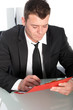 Professional young man studying a file