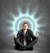 Businessman meditating, relaxing