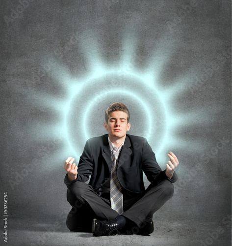Photo: Businessman meditating, relaxing Businessman meditating, relaxing