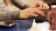 HANDS TYPING ON KEYBOARD