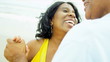 Senior Ethnic Couple Dancing Beach