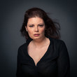 Sensual red head woman close up portrait on dark background.