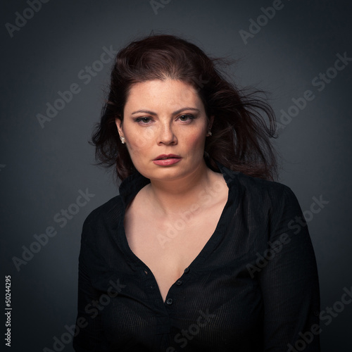 Photo: Sensual red head woman close up portrait on dark background. Sensual red head woman close up portrait on dark background.