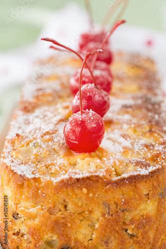 Photo: Close-up of homemade fruit cake with Maraschino cherries decorat Close-up of homemade fruit cake with Maraschino cherries decorat