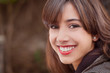 Happy brunette with a big smile looking at camera