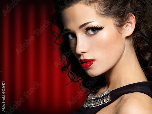 Photo: Beautiful face of brunette woman with red lips Beautiful face of brunette woman with red lips