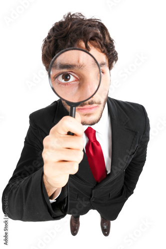 Photo: Business man with magnifying glass Business man with magnifying glass
