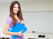 Portrait of a young cute student in her classroom