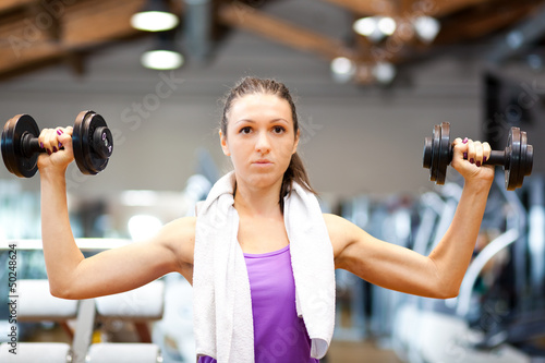 Photo: Fitness woman working out Fitness woman working out