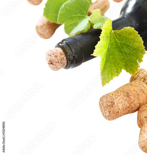 Photo: Bottle corks and bottle on the white background Bottle corks and bottle on the white background