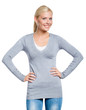 Girl wearing grey sweater stands with hands on the hips