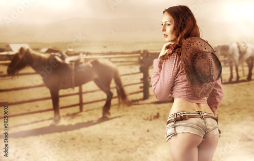 Photo: Sexy cowgirl wearing jeans shorts Sexy cowgirl wearing jeans shorts