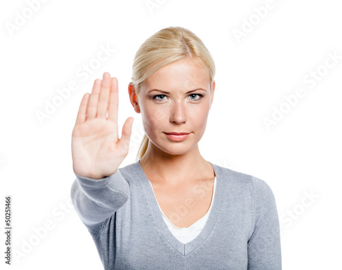 Photo: Lady making stop gesture with her palm, isolated on white Lady making stop gesture with her palm, isolated on white